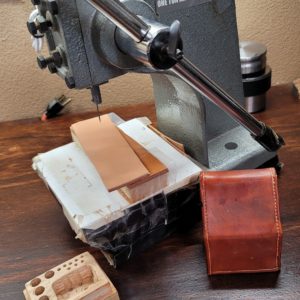 One of the most difficult and most critical parts of building a sheath or other stitched leather product is a stitch hole that is perfectly aligned on both sides of the product. This gets more difficult the thicker the piece is. This document shows how to modify and use an arbor press for perfect stitching holes.